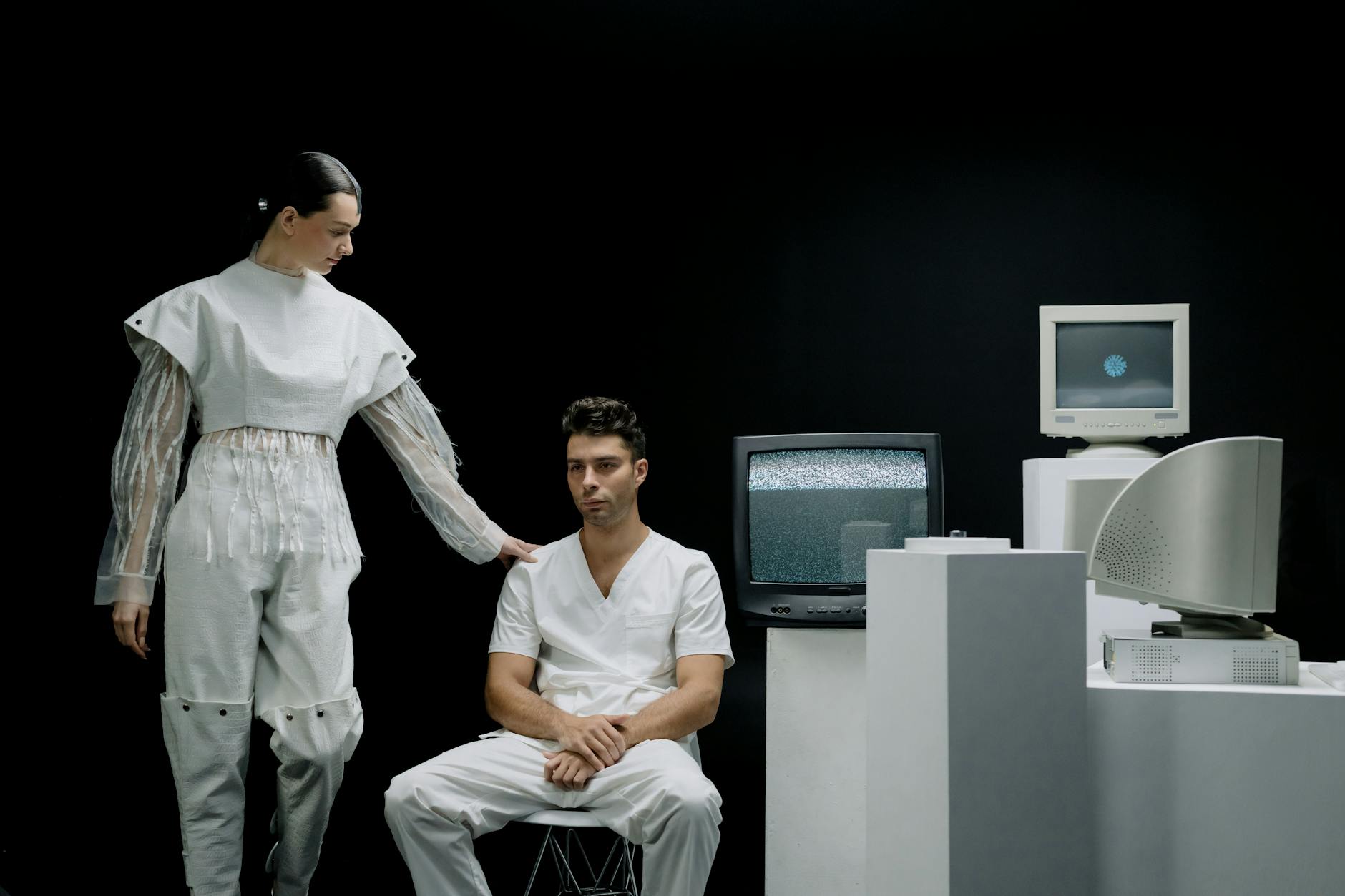 A modern scene with people in futuristic fashion amidst vintage technology.