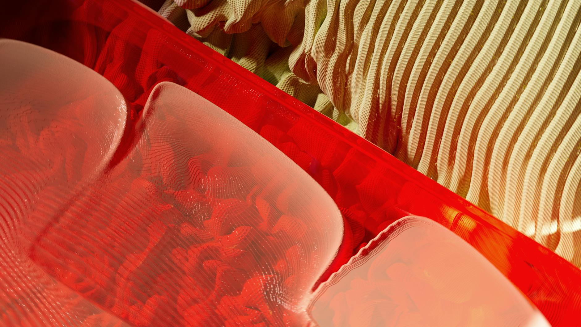 Artistic abstract with bright red and beige patterns and textures.