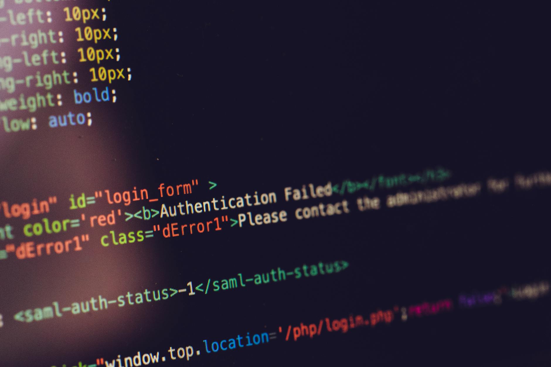 Close view of computer screen displaying HTML code with an authentication error.